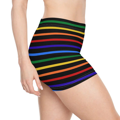 A pair of women's shorts featuring a striped pattern a glittery heart, and vibrant rainbow colors on a black background.