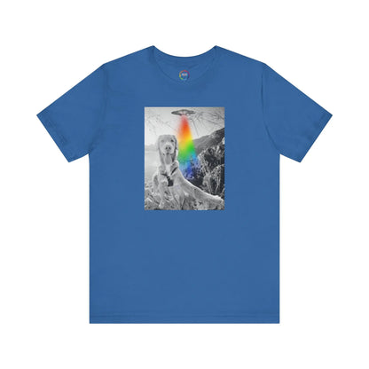 Blue t-shirt with a graphic of a UFO, a dog and a rainbow on a white background