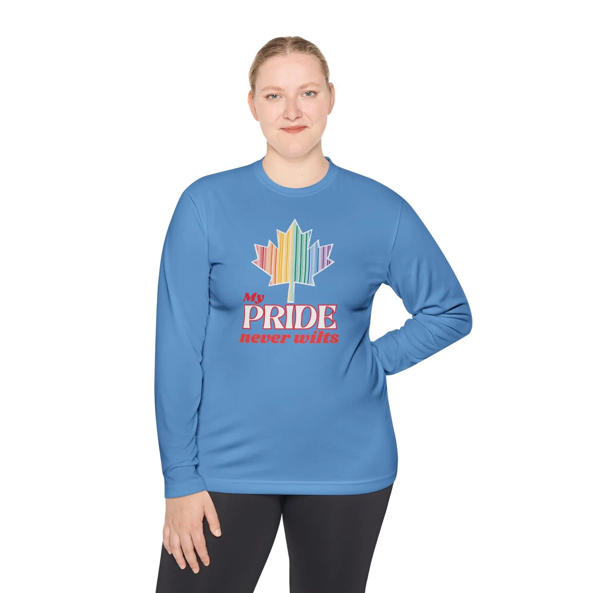 A person wearing a long sleeve Carolina blue t-shirt with a colorful graphic that reads 'My PRIDE never wilts'.
