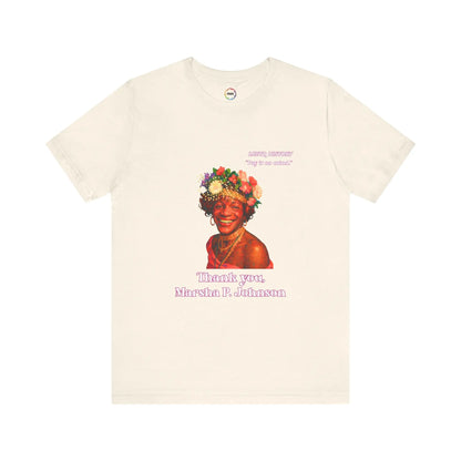 Beige t-shirt with a graphic of Marsha P. Johnson with flowers and text on a white background