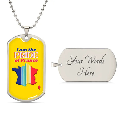 A dog tag necklace with a bright yellow background featuring a colorful map of France and the text 'I am the PRIDE of France'.