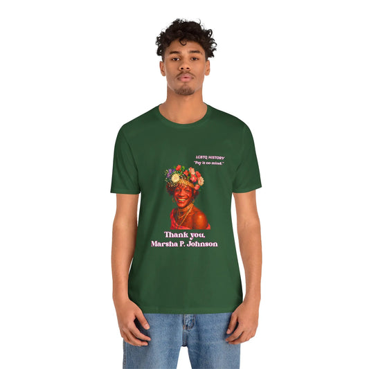 Person wearing a green t-shirt with a Marsha P. Johnson graphic and text on a white background