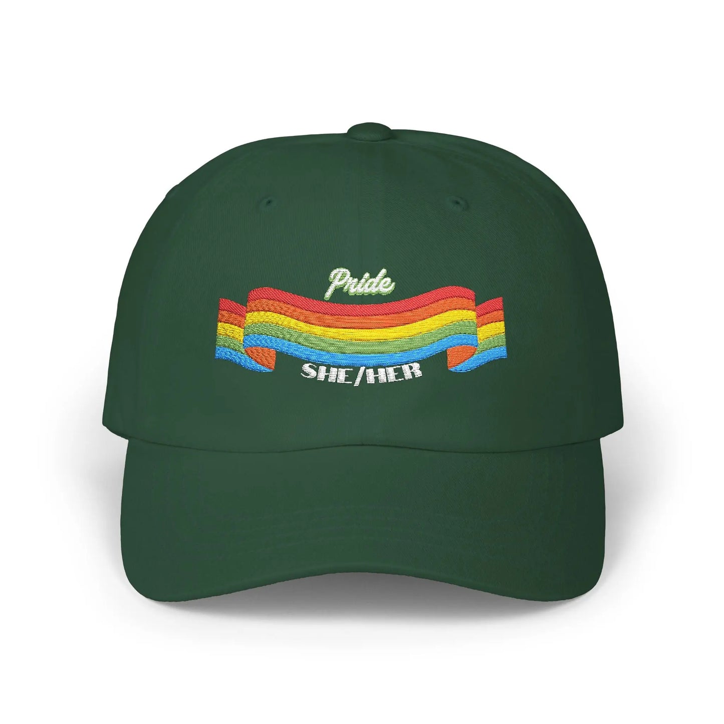 A green cap from the Worldwide PRIDE store, featuring a rainbow design and the embroidered pronouns she/her.