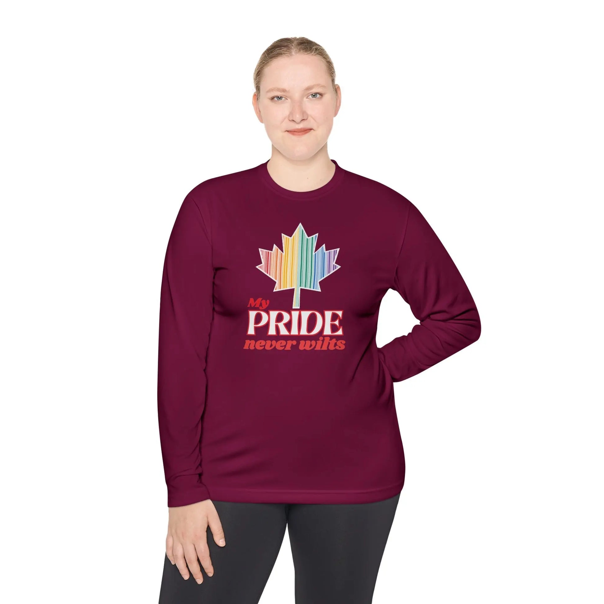 A person wearing a long sleeve maroon t-shirt with a colorful graphic that reads 'My PRIDE never wilts'.