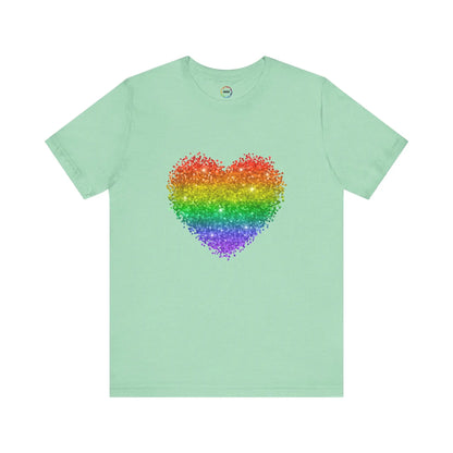 A mint green t-shirt with a glitter rainbow heart design.