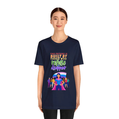 A person wearing a navy blue unisex short-sleeve t-shirt with text saying, "The future is built by those who refuse to disappear," and graphic design.