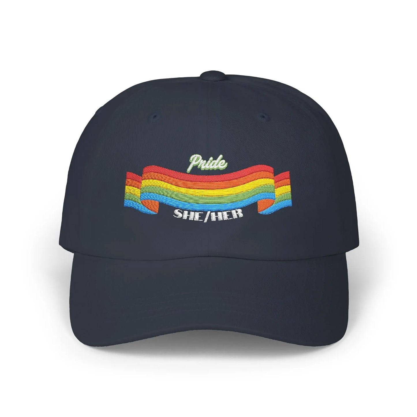 A navy blue cap from the Worldwide PRIDE store, featuring a rainbow design and the embroidered pronouns she/her.