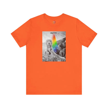Orange t-shirt with a graphic of a dog with a rainbow and UFO on a white background