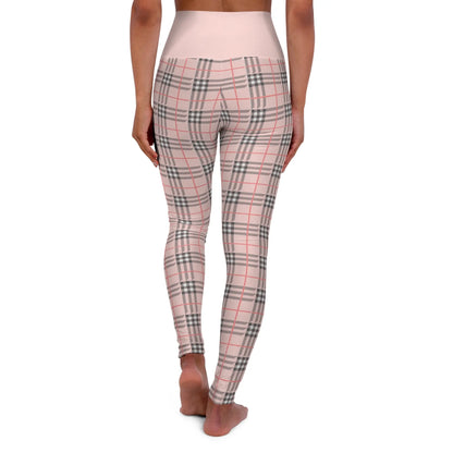 Back view of a person wearing a pair of high waisted yoga leggings with a plaid pattern.