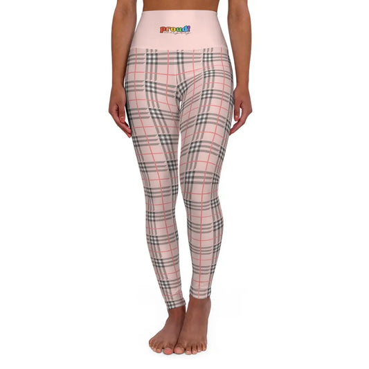 A person wearing a pair of high waisted yoga leggings with a plaid pattern and a visible brand logo that reads "proud everyday" on the waistband.