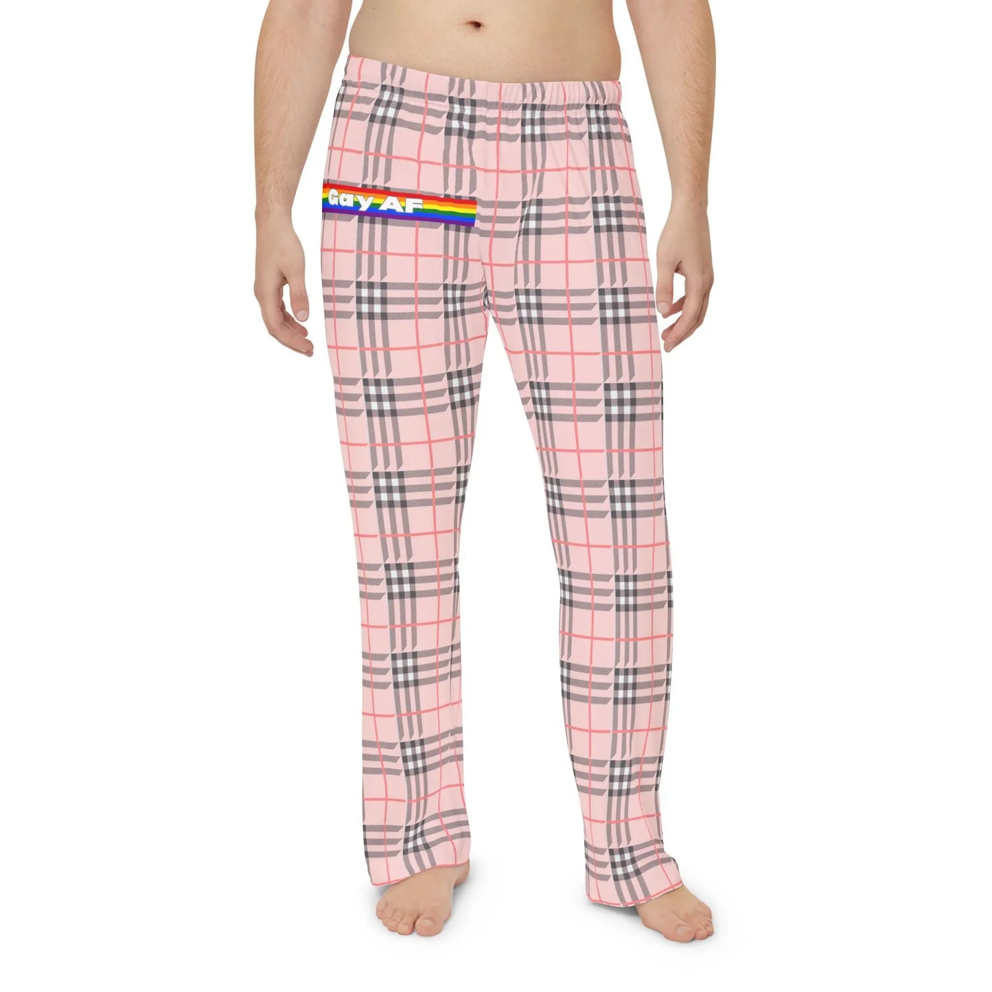A person wearing a pair of multicolored plaid pajama pants with 'Gay AF' text on the right leg