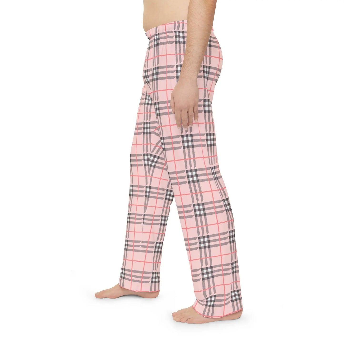 Plaid pajama pants worn by a person on a white background