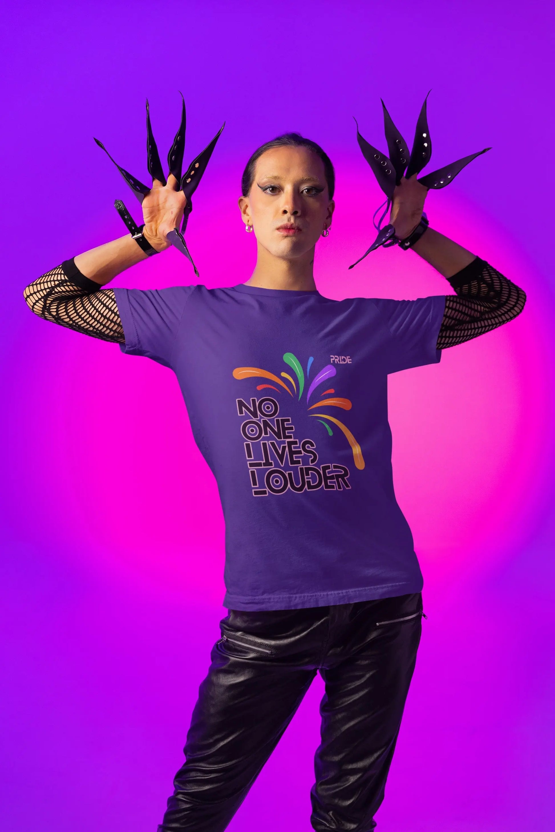 A person wearing a purple short sleeve tee with text saying "No One Lives Louder" and a fireworks design.