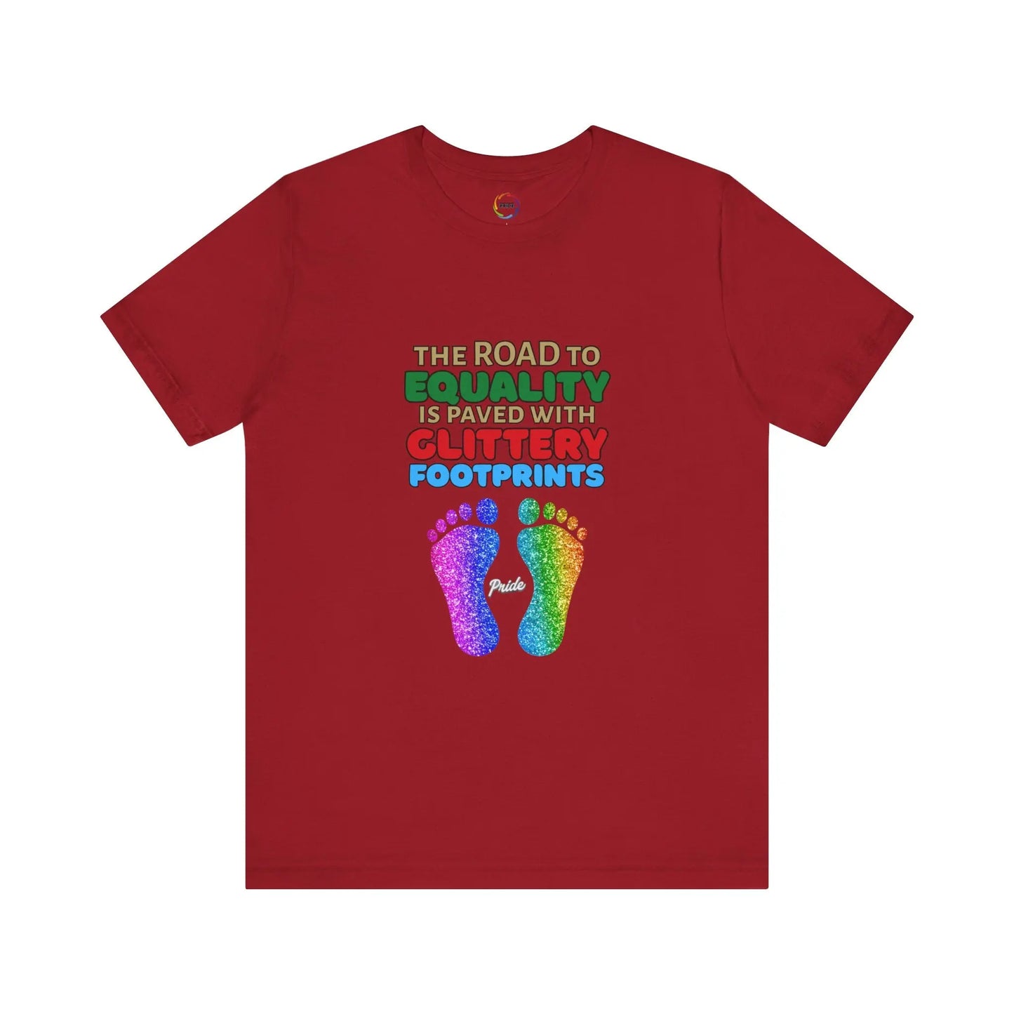 A red unisex short-sleeve t-shirt with a graphic of multicolored glitter footprints and the text 'THE ROAD TO EQUALITY IS LITTERED WITH GLITTERY FOOTPRINTS'.