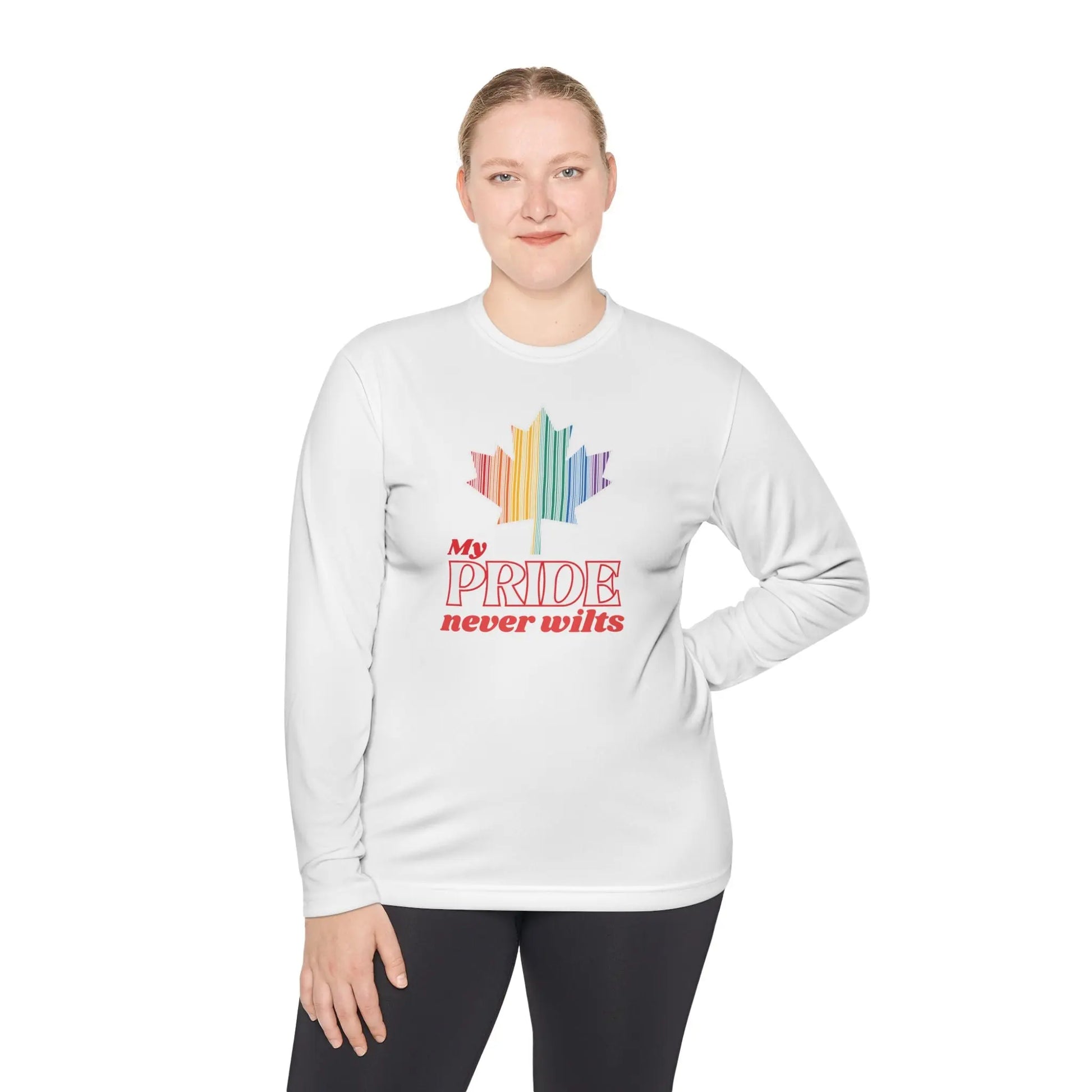A person wearing a long sleeve white t-shirt with a colorful graphic that reads 'My PRIDE never wilts'.