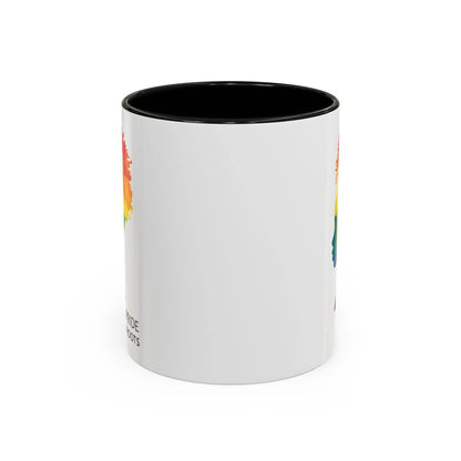 A white mug with a black handle and rim, featuring a vibrant geometric silhouette of a womans head with a rainbow afro and MY PRIDE HAS ROOTS below—perfect for the LGBTQ community from The Worldwide PRIDE Store.