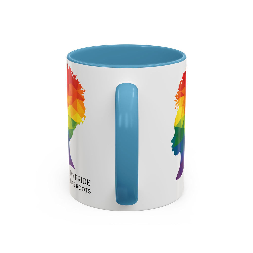 A white mug with a light blue handle and rim, featuring a vibrant geometric silhouette of a womans head with a rainbow afro and MY PRIDE HAS ROOTS below—perfect for the LGBTQ community from The Worldwide PRIDE Store.