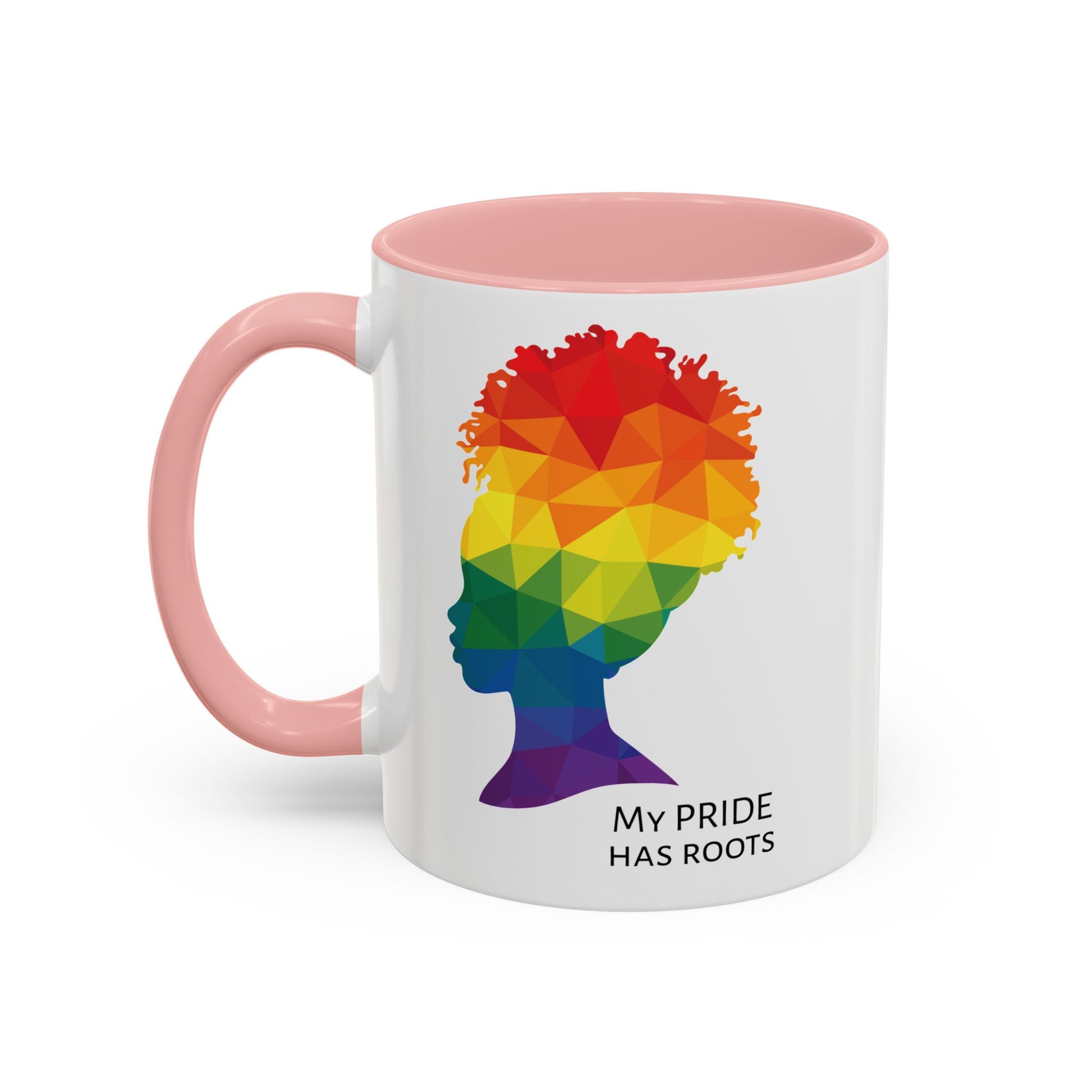 A white mug with a pink handle and rim, featuring a vibrant geometric silhouette of a womans head with a rainbow afro and MY PRIDE HAS ROOTS below—perfect for the LGBTQ community from The Worldwide PRIDE Store.