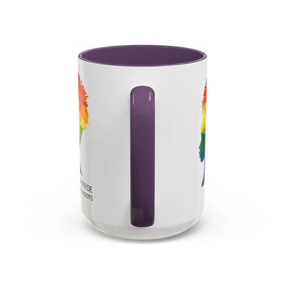 A white mug with a purple handle and rim, featuring a vibrant geometric silhouette of a womans head with a rainbow afro and MY PRIDE HAS ROOTS below—perfect for the LGBTQ community from The Worldwide PRIDE Store.
