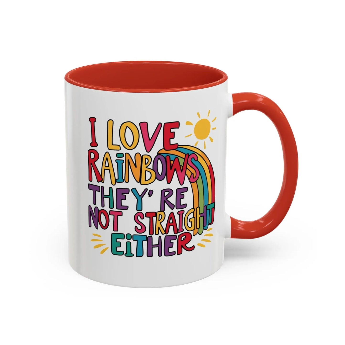 A white ceramic coffee mug with a red handle and interior, featuring the colorful text 'I LOVE RAINBOWS THEY'RE NOT STRAIGHT EITHER' along with a graphic of a rainbow and a sun.